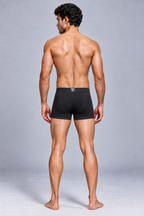 CotCloud men's cotton trunk in Black — back view on model (Build Your Own 3-Pack)